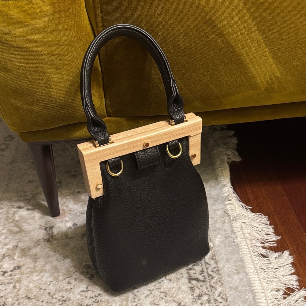 Elegant Black Handbag with Gold Accents